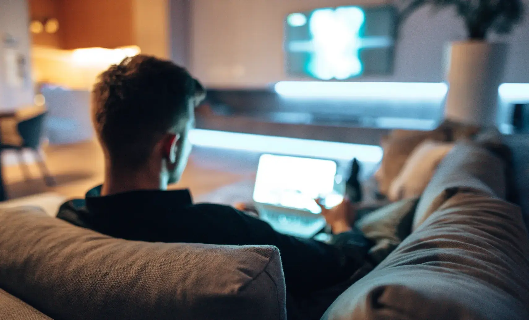 Man at home using laptop