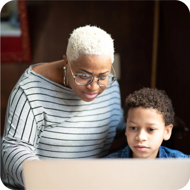 Adult supervising the child's use of the computer