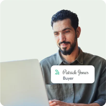 A man, Patrick Jones, esigning a document as the buyer