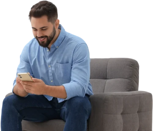 Man sat on chair using his smartphone