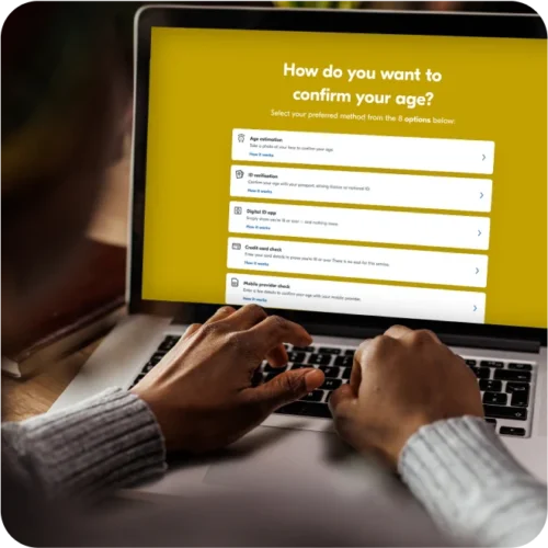 Person using laptop, choosing which method they would like to use to confirm their age