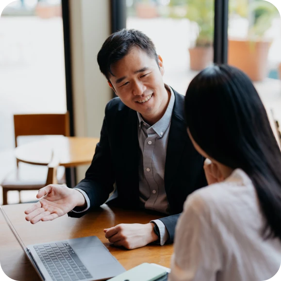 Man and woman working together at a laptop