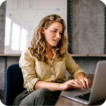 Woman at laptop on a desk